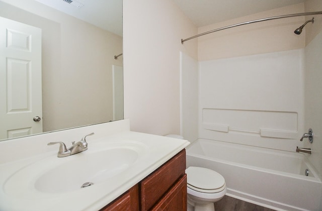 26810 Blacktail Ct, Hockley, TX 77447 - bathroom featuring visible vents, toilet, wood finished floors, vanity, and  shower combination