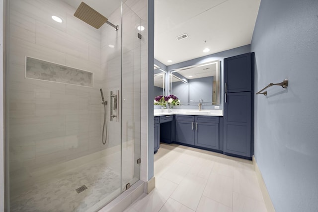 bathroom with recessed lighting, vanity, visible vents, baseboards, and a shower stall