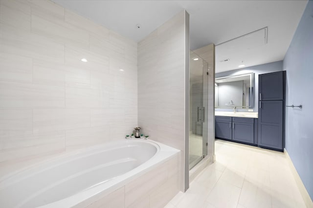 full bath with a garden tub, a shower stall, tile patterned flooring, and vanity