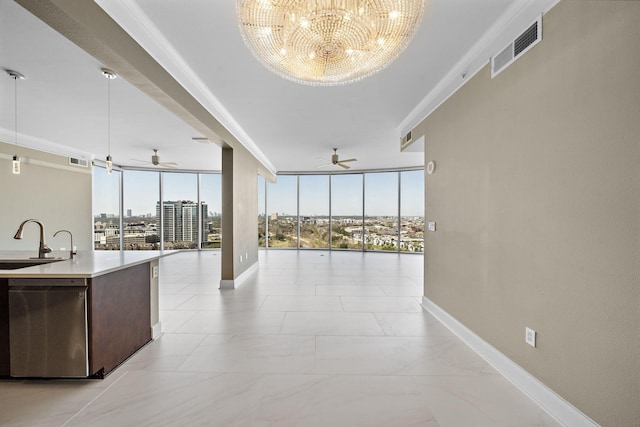 kitchen featuring a city view, visible vents, open floor plan, a sink, and a wall of windows