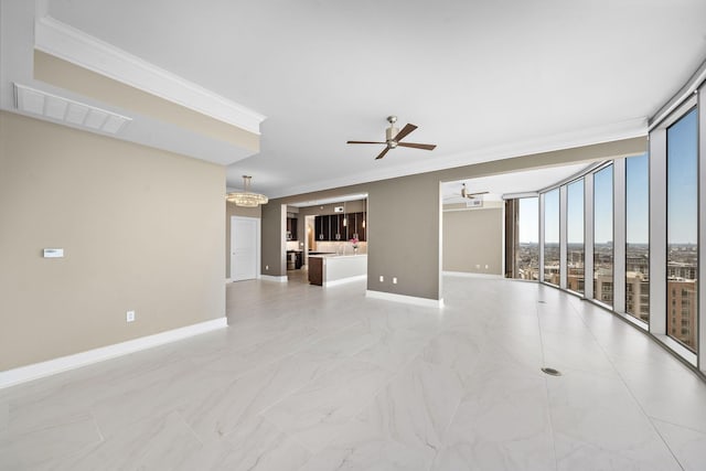 empty room with ceiling fan, visible vents, baseboards, expansive windows, and crown molding