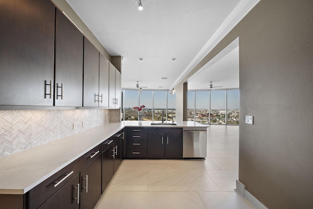 kitchen with decorative backsplash, stainless steel dishwasher, a ceiling fan, a sink, and a peninsula