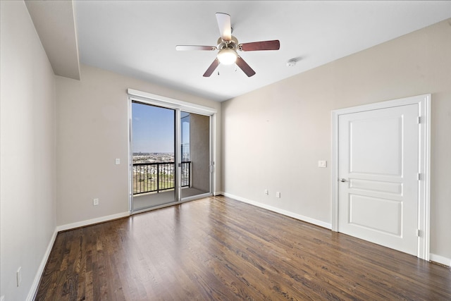 spare room featuring ceiling fan, wood finished floors, and baseboards