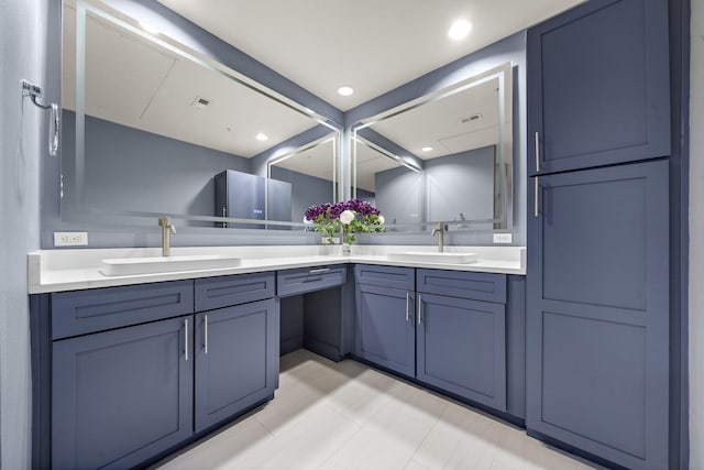 full bath with visible vents, a sink, and double vanity