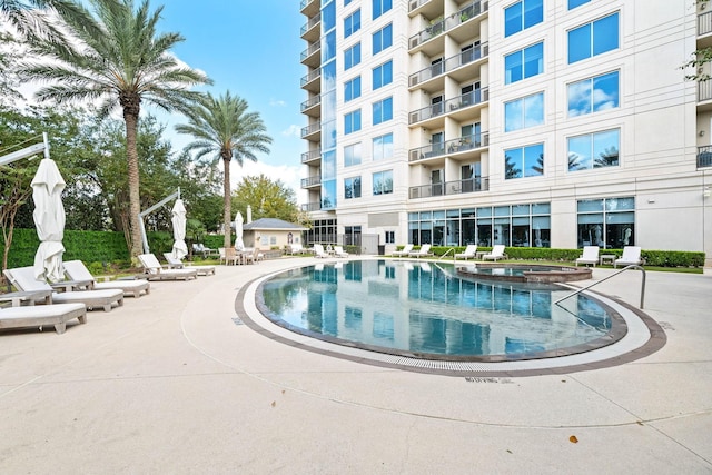 view of pool featuring a community hot tub