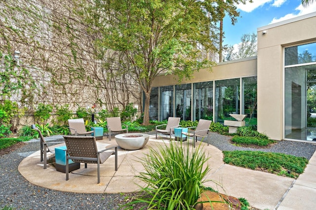 view of patio with a fire pit