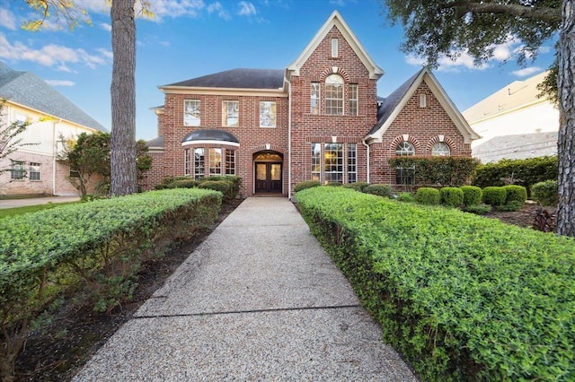 view of front of house featuring brick siding