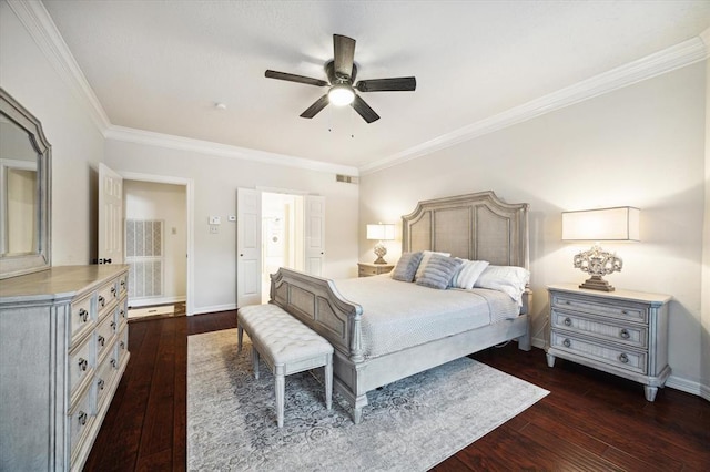 bedroom with ornamental molding, dark wood-style flooring, visible vents, and baseboards