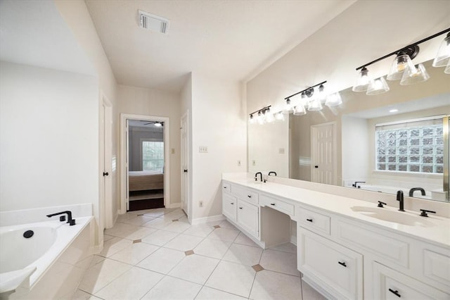 full bath with visible vents, a sink, a garden tub, and double vanity