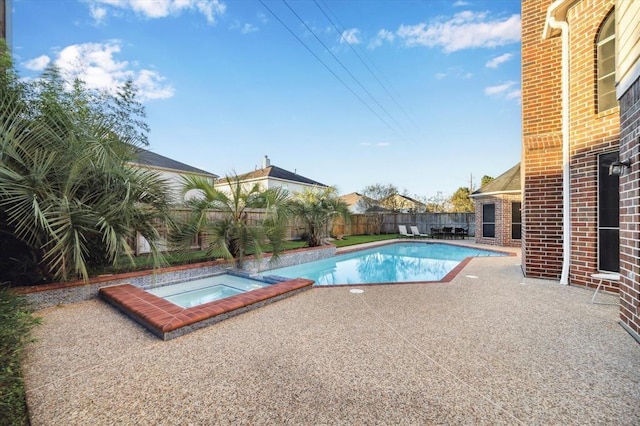 view of pool featuring a patio area, a fenced backyard, a fenced in pool, and an in ground hot tub