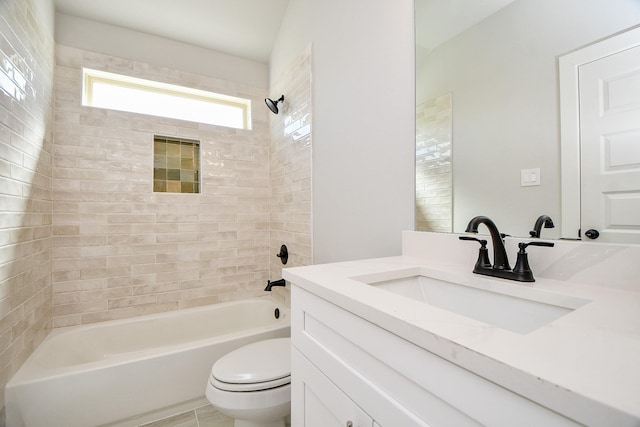 bathroom featuring vanity, bathtub / shower combination, and toilet