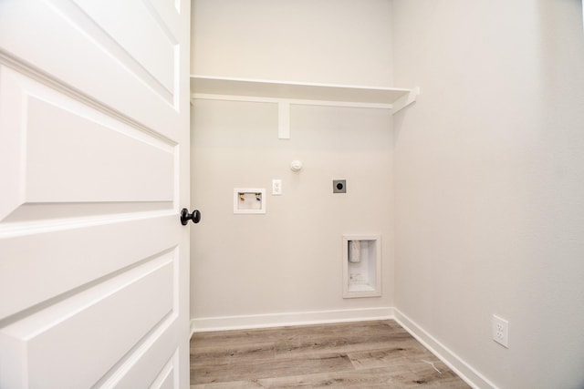 laundry area featuring light wood finished floors, hookup for a washing machine, electric dryer hookup, laundry area, and baseboards