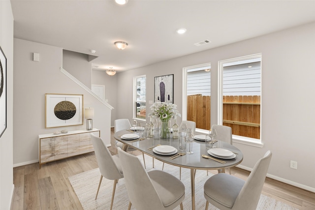 19126 Hazel Firs Ln, Magnolia, TX 77355 - dining space with light wood finished floors, baseboards, and recessed lighting