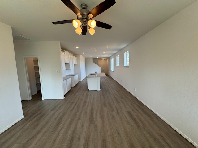 19126 Hazel Firs Ln, Magnolia, TX 77355 - unfurnished living room with dark wood finished floors, ceiling fan, baseboards, a sink, and recessed lighting