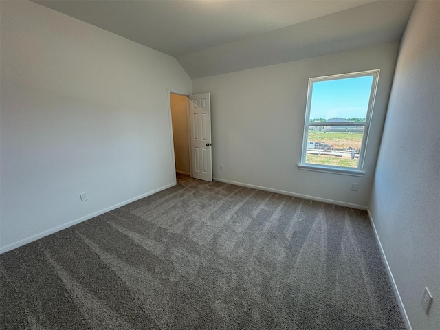 19126 Hazel Firs Ln, Magnolia, TX 77355 - empty room with baseboards, vaulted ceiling, and carpet