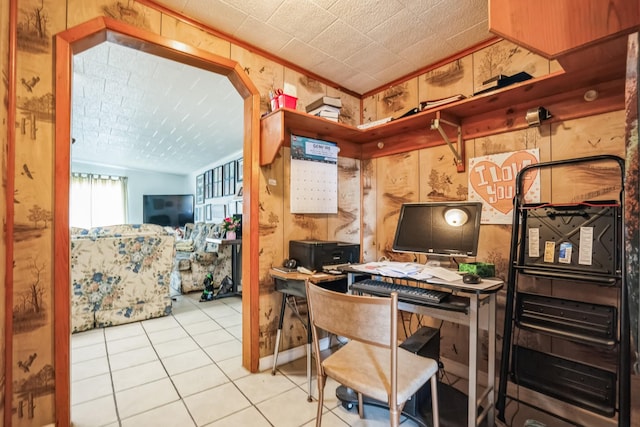 home office with crown molding and tile patterned floors