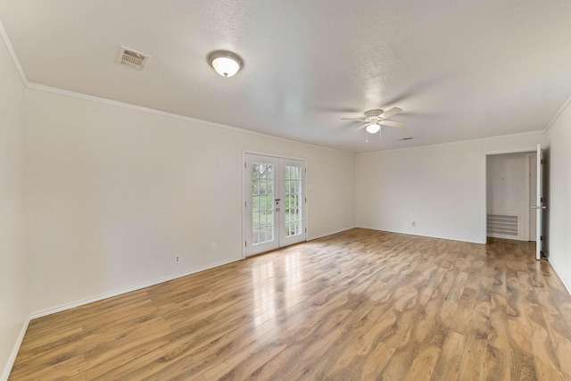 3230 Virginia St, La Marque, TX 77568 - unfurnished room featuring light wood finished floors, visible vents, ceiling fan, crown molding, and french doors