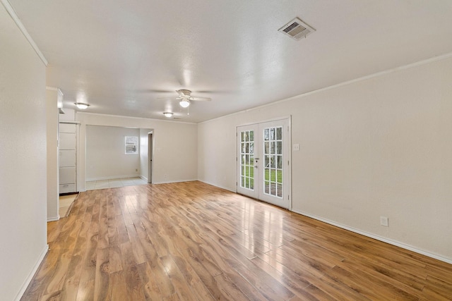 3230 Virginia St, La Marque, TX 77568 - empty room featuring visible vents, ceiling fan, ornamental molding, french doors, and light wood-type flooring