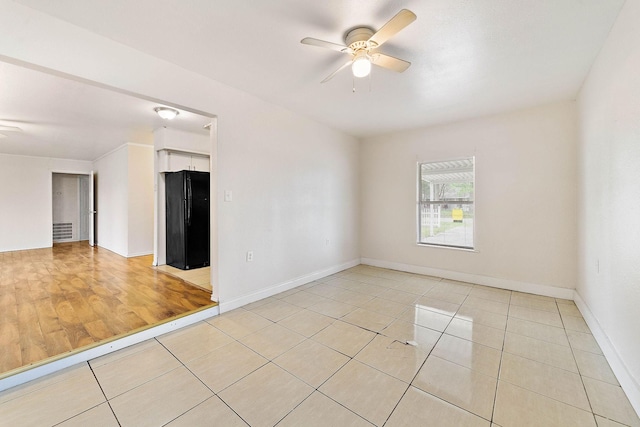 3230 Virginia St, La Marque, TX 77568 - spare room featuring light tile patterned floors, baseboards, visible vents, and a ceiling fan
