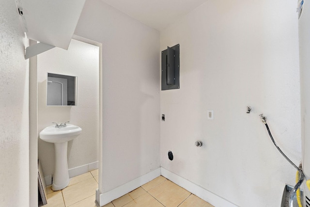 3230 Virginia St, La Marque, TX 77568 - bathroom with tile patterned flooring, electric panel, baseboards, and a sink