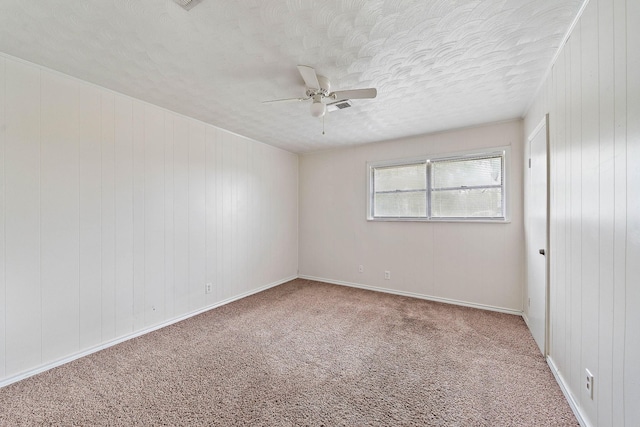 3230 Virginia St, La Marque, TX 77568 - carpeted spare room with visible vents, a ceiling fan, and a textured ceiling