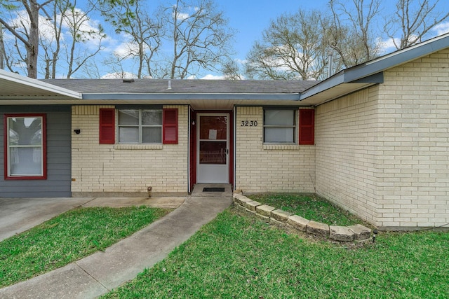 3230 Virginia St, La Marque, TX 77568 - entrance to property with a lawn and brick siding
