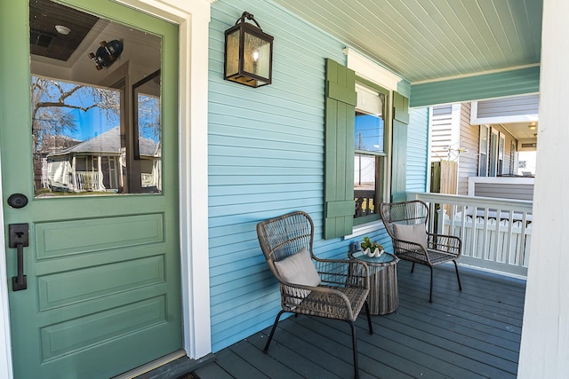 wooden terrace featuring a porch