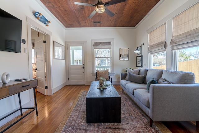 living room with a wealth of natural light, wooden ceiling, visible vents, and hardwood / wood-style floors