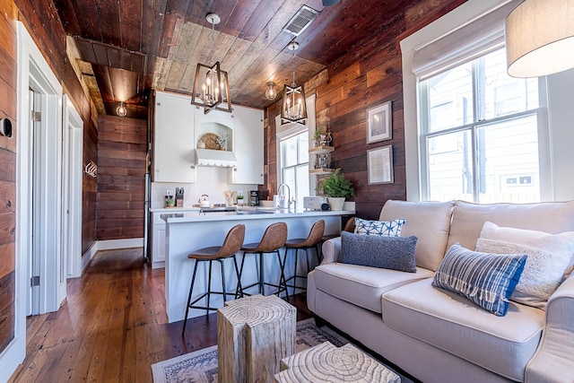 kitchen featuring wooden ceiling, wood walls, open shelves, and dark wood-style flooring