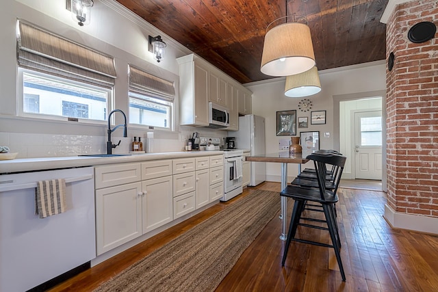 kitchen featuring white cabinetry, white appliances, wooden ceiling, and a healthy amount of sunlight