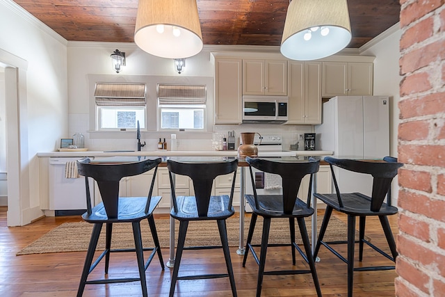 kitchen featuring ornamental molding, white appliances, wooden ceiling, and a sink