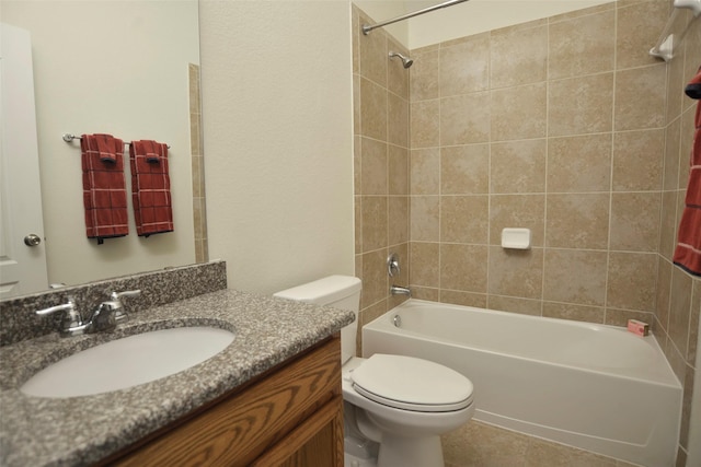 bathroom with bathtub / shower combination, vanity, and toilet