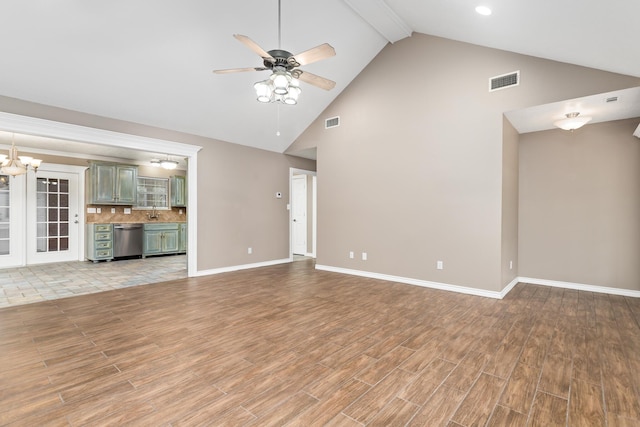 unfurnished living room with light wood-style floors, visible vents, and ceiling fan with notable chandelier