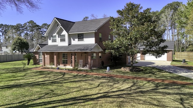 view of front facade featuring brick siding, fence, a porch, a front yard, and a garage