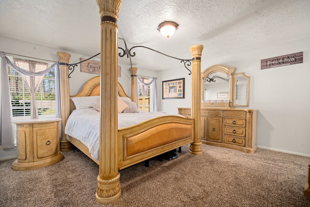 bedroom featuring a textured ceiling, carpet, and baseboards