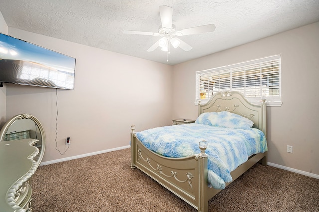 carpeted bedroom featuring a textured ceiling, a ceiling fan, and baseboards