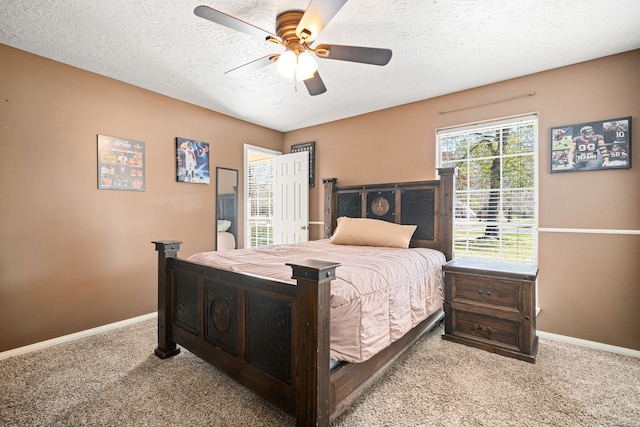 bedroom featuring carpet flooring, ceiling fan, a textured ceiling, and baseboards