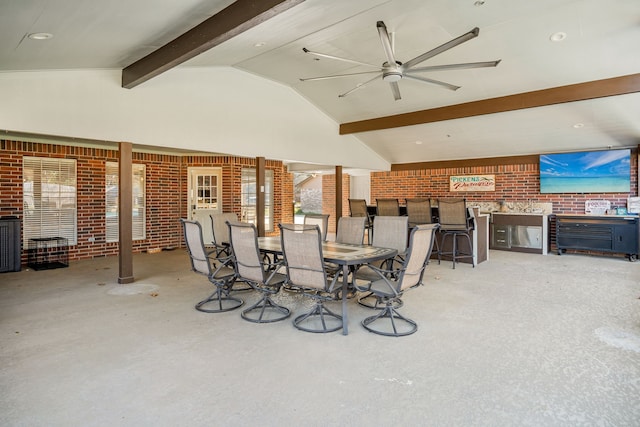 view of patio with outdoor dining space and a ceiling fan