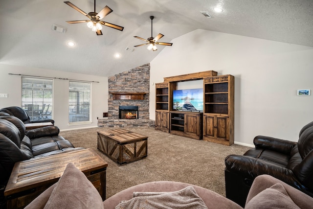 carpeted living room with high vaulted ceiling, visible vents, a stone fireplace, and a textured ceiling