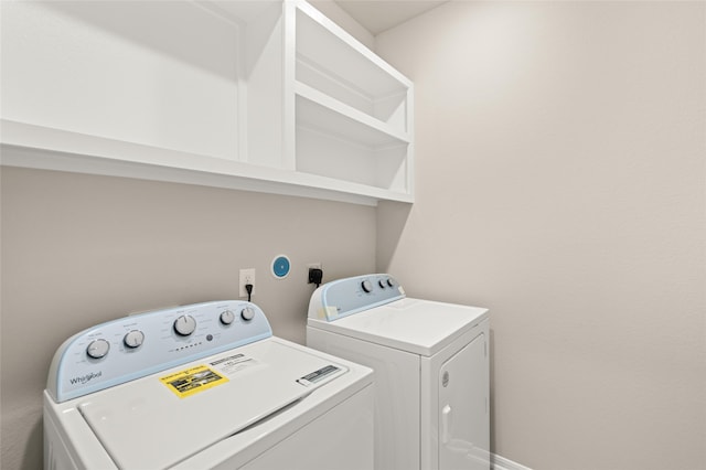 clothes washing area with laundry area and separate washer and dryer