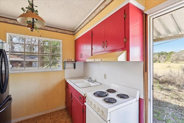 kitchen featuring red cabinetry, a sink, under cabinet range hood, and white range with electric cooktop