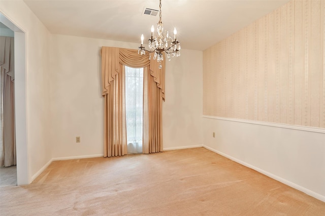 unfurnished room with wallpapered walls, visible vents, baseboards, an inviting chandelier, and carpet