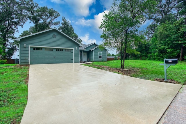 ranch-style house featuring concrete driveway, a front lawn, and an attached garage