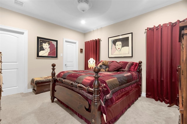 bedroom with light carpet, baseboards, visible vents, and crown molding