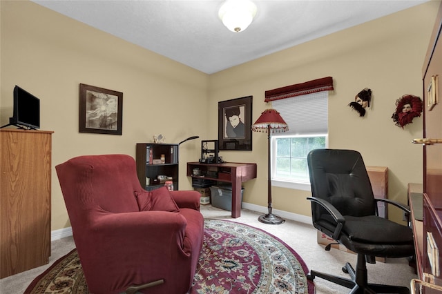 carpeted home office with baseboards