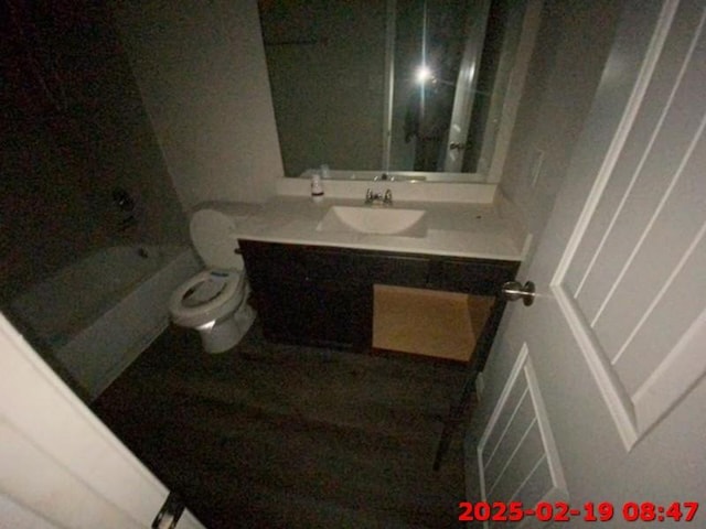 full bathroom featuring toilet, visible vents, and vanity