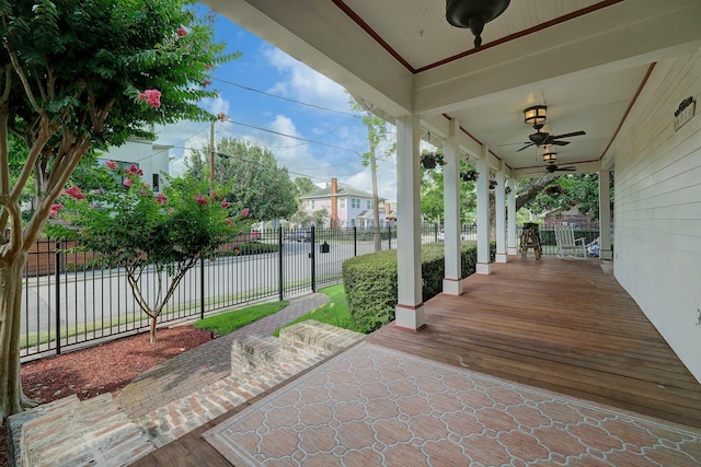 view of patio / terrace featuring covered porch, ceiling fan, and fence