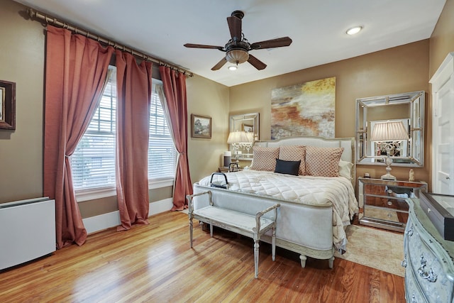 bedroom with recessed lighting, a ceiling fan, light wood-type flooring, and baseboards