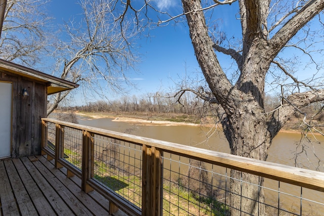 wooden deck featuring a water view