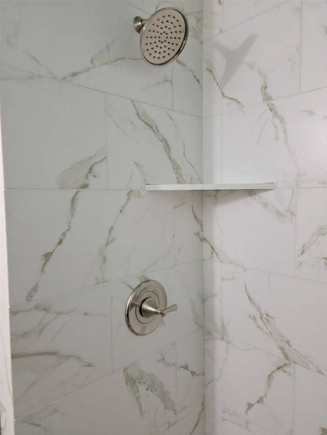 room details with a marble finish shower